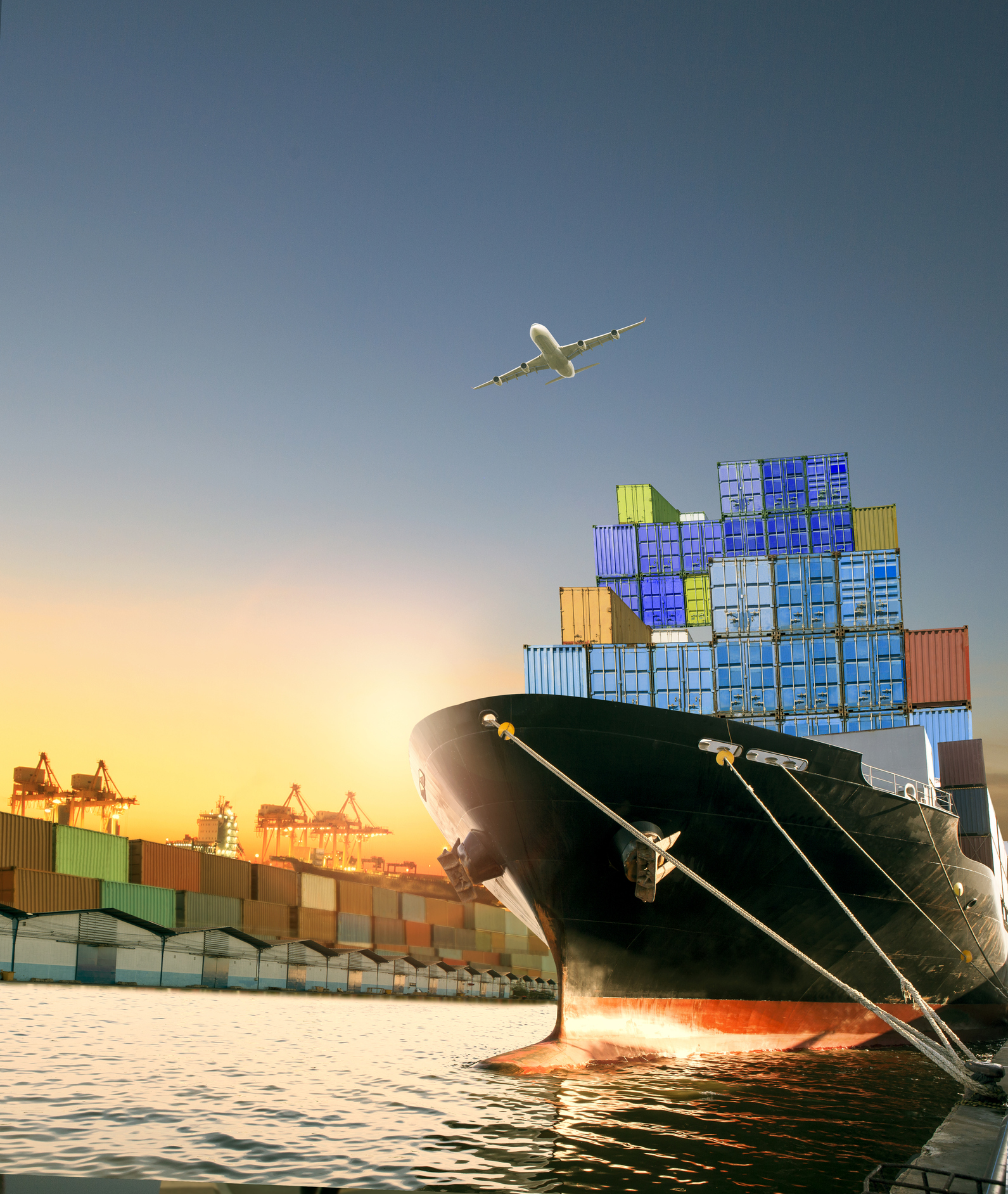 ship and container box and cargo plane flying over shipping dock use for logistic and international transportation Cargofast - Quem Somos